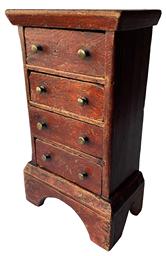 F212 Rare Southern diminutive tall four drawer Chest circa 1790-1800 ,in original red decorated paint, the wood is yellow pine , with a applied boot jack cut out base. The drawers are tee nailed construction, the drawer divider are mortised into the sides. The surface on this little chest is outstanding 8" wide x 4 1/2 " deep x 14" tall