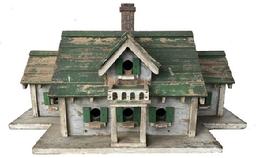 F98 Early 20th century South Carolina Folk Art Carved and Painted two Story Bird House Circa 1920. with eleven compartment. A lot of detail and workmanship with into making the Bird House