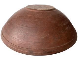 F322 Late 18th century New England original dry red painted large Beehive wooden bowl . It is out of round, Bold form, with broad inner rim tapering subtly downward, showing strong evidence of slow lathe turning,.