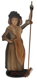 D98Mid 20th century Wooden hand painted Quaker Lady advertisement for Quaker Farm Stores, she is painted on board holding a rake ( might be replaced) standing on a wooden base with raised letters painted red.