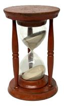 **SOLD** RM1641 Large early 20th century Hourglass bearing old red painted surface. Blown glass encradled in a wooden base and top with three turned spindles. The sand runs approximately one hour. Overall measurements: 6 diameter x 9 ¼ tall.