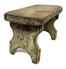 M257 19th century original blue painted Stool featuring a nice cut out design on each leg/end of the stool. The legs are double mortised through the top. Very sturdy. Circa 1840. The wood is white pine. Measurements: 12" long x 7" deep x 7 1/2" tall