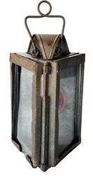 **SOLD** L50 19th century triangular shaped tin and glass railroad candle lantern featuring two glass panels and a 2 &frac12;� diameter round red glass lens marked �Jefferson 925�. The top features a hood to protect the internal candle flame from wind/rain. Shaped heavy wire handle on top for carrying / hanging purposes. One of the glass panels slides upwards for access to the candle chamber. Very sturdy lantern with good weight. Measurements: ~8 &frac12;� tall (not including handle) x 5 &frac12;� wide on sides.  