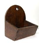 RM1541 Diminutive Pennsylvania Wall Box featuring canted sides and a tombstone shaped back with a hole for hanging. The wood is walnut and retains its original old finish. Square head nail and early screw construction. Circa 1840s. Measurements: 3 ¾ wide x 2 ½ deep x 4 tall (Back) x 1 ¼ tall (front)