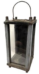 M271 Late 19th century Pennsylvania old blue painted wooden Lantern featuring three glass panels and a wooden panel with leather hinges contained within a wooden pinned and post construction frame resting on four short legs. Door opens freely to access the interior. There is a hole in the top for ventilation purposes which is covered on the exterior with a rusty old piece of punched / pierced sheet iron and the interior fitted with a large opening in the base and having a removable board which fits over the opening A wrought iron wire bail handle is attached to the top for carrying/hanging purposes. Measurements 6 square x 12 ¼ tall at corner posts. Overall height is approximately 15 tall including handle in upright position.