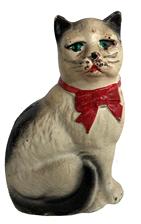 E468 HUBLEY Cast Iron Cat Bank Fabulous vintage 1900s cast iron bank, Manufacturing Company of Pennsylvania. The body is white with black accents on the ears and tail, with a bold red bow around its neck. Back of head has a coin slot and back screw for easy opening. It's in excellent condition with no damage