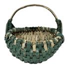 RM1646 Miniature rib and split oak hand-woven egg / buttocks basket in original green and white painted surface featuring single wrapped rim with Eye of the Wind God detailed weaving at junction of the two major ribs that construct the handle and rim. Measurements: ~5 x ~4 ¾ tall.