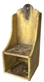 RM1575 Late 19th century unique shape and style Eastern Shore, Maryland wooden candle shelf in old mustard painted surface. Shelf bears wear and scorch marks from years of use. Solid pine wood. Combination of small square head and wire nail construction with the back board being mortised into the sides. Circa 1870s-1900. Measurements:  6 ¾ wide x 6 ¾ deep x 15 tall.