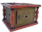 W288 19th century Foot Warmer, with the original bittersweet red paint decorated with black pin stripes, with baluster-turned supports; punched tin is decorated with circle and heart. Retains its original coal holder inside. . American, mid- 1900 9" wide *" deep wide x 6" tall