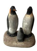 K1839 Hand carved and painted Folk Art Penguin Family � signed on bottom � Rick M�.� (illegible last name). Solid wood construction. Measurements: 3 7/8� wide x 2 &frac34;� deep x 3 &frac12;� tall. 
