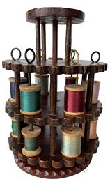 F180 19th century Painted revolving spool holder, Pennsylvania revolving tread holder or caddy. Extremely nice in old dark red paint , very nicely crafted, upper and lower tires revolve around stationary center shaft and base Measurements are 8" high