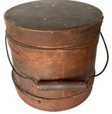 **SOLD** RM1076 Rare Small Shaker Bail-Handle Sugar Bucket, Firkin, Red Paint, Circa 1860 - 1880 As depicted, tapered sides, staved construction with wire and turned wood bail handle, three single finger bands and sheet iron diamond shaped escutcheon plates. Wonderful dry red painted surface Measurements: 5 3/4" tall, Diameter is 6 3/8" (bottom) and 5 7/8" (top)