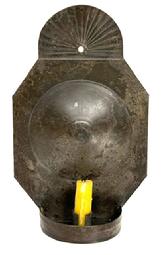 **SOLD** M238B 19th century hanging tin wall Sconce with wonderful rounded, fan-shaped, crimped and fluted top and deep convex circle on the back. Circa 1810 - 1820, very unusual size and form, finely folded edges, hole on back for hanging and a demilune dish holding a single rolled edge candle socket that is 1" tall. Solder joints are secure. Sconce retains wonderful natural patina surface. Measurements: 7 ¼ wide x 2 5/8 deep x 11 ½ tall.