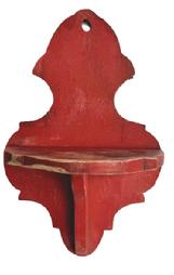 **SOLD** RM1635 Late 19th century hanging candle shelf retaining an early old red paint with decorative shaped shelf and back. Hole in top for hanging purposes. The wood is poplar. Measurements: 9 wide x 5 ½ deep x 13 ¾ tall. (NOTE: The depth of the shelf area is 4 ¾ deep and it is 7 3/8 down from the top of back board).