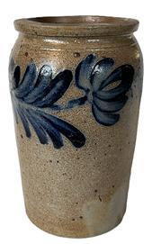 K1741 19th century cobalt blue decorated Stoneware Jar attributed to Peter Hermann of Baltimore, Maryland. Beautiful hand painted heave cobalt blue flowers encircle the tall, cylindrical form with flat bottom, tooled shoulder, and slightly flared, flat-topped rim. Great condition. Peter Hermanns pottery was on Edger Street in Baltimore from 1850-1872. Measurements: 4 ¾ top diameter x 5 1/8 bottom diameter x 8 ¾ tall.