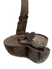 L408F Hand forged Iron hanging Betty Lamp / Whale / Fish Oil Lamp with hinged reservoir cover with heart-shaped locking finial, twisted iron spike hanger and internal wick support. Fantastic surface with evidence of hand forging / filing. Approximate measurements: 3 wide x 3 ½ deep x 4 ¾ tall. Overall height is 13 tall with spike hanger.