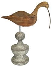 K1714 Hand carved wooden Curlew Shore Bird with long, curved bill. Carver unknown. Decoy has tack eyes and metal bill. It is solid wood with scarce remnants of original paint in some areas and has been mounted on a decorative wooden base for display purposes. Measurements: 13 &frac12;� long x ~5/8� thick x 17 &frac12;� tall (mounted height). 