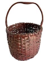 **SOLD** M46 Early oval shaped hand-woven splint gathering basket in its original dark barn red painted surface - featuring a double-wrapped double-rim with a notched, hand hewn steamed and bent handle. This is very nicely made, smaller sized basket in great condition. Approximate measurements: 10 ½ x 7 ¾ x 6 tall sides. Overall height at handle is ~11.