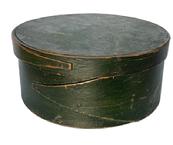 F526 19th century New England Pantry Box in its dry original Windsor green paint. Steamed and bentwood sides with opposing fingered body and lid secured with tacked and wooden pegged construction. Natural patina interior. Circa 1850s. Measurements: 8 diameter x 3 ½ tall.