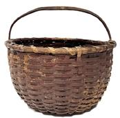 M274A Sturdy 19th century tightly hand-woven round gathering basket with single wrapped rim in original dark red painted surface. Thick steamed and bent, notched handle is woven into the sides of the basket. Tightly woven, significantly bumped up bottom interior to help with weight distribution and enhance airflow for gathered items. Minor losses with great wear. Measurements: 15 ½ x 14 ½ diameter across top x 8 ½-9 tall sides (depending on where measured) x ~13 ½ tall with handle.