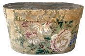 K132 19th century Philadelphia, Pennsylvania wallpaper Hat Box or Bandbox. The outside of the oval pasteboard box bears remnants of wallpaper bearing a pastel floral pattern. The interior and bottom of this box is covered in newspaper dated 1858 from the Philadelphia, Pennsylvania area. Measurements: 7 ½ wide x 4 ½ deep x 4 ¼ tall