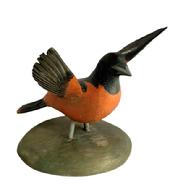 M312 Hand carved and painted Baltimore Oriole signed on bottom Rich Moretz (b. 1976) of Havre de Grace, Maryland. Mounted on a wooden base for display purposes. Measurements: Base is 5 ¾ x 6 diameter. Bird measures ~8 long with ~7 ½ wingspan and is ~6 tall.
