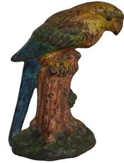F225 Magnificent Antique Cast Iron Doorstop Parrot on Tree Stump Best Original Paint. Measures 7 1/2" tall and weighs 3.6 pounds. This is the smaller of the 2 versions made by National Foundry. The same model doorstop is shown on page 97 of The Doorstop Encyclopedia by Smith as shown in our last 2 photos, it is guaranteed a genuine old pre-war era doorstop. stamped on the back, bottom left hand corner with “39”.