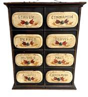 L328 Mid 19th century Tin Toleware Spice Box featuring 8 drawers with oval fronts bearing hand painted labels for Ginger, Cinnamon, Pepper, Cloves, Nutmeg, Mace, Allspice, and Cardamon. The base paint is a technique called Black Japanning, which was a technique used on early metals to render it rust proof perfect for such items as spice boxes. Circa 1850s. Measurements: 9 wide x 3 ½ deep x 11 ¼ tall. Drawers measure 2 7/8 x 2 7/8 deep with 3 ½ wide x 1 ½ tall oval drawer fronts.