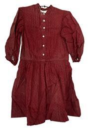 (i308) Mid-19th century Childs Turkey Red cotton dress with pearl buttons. Childrens clothing was made with additional tucks that could be let out as the child grew. The fading at the tuck seams of this example provides evidence this dress was used for a long period of time as several tucks have been let out and show various degrees of fading. There is extensive deterioration of the fabric which is common with Turkey Red prints - due to ingredients used in the dye process to create the distinctive color. Circa 1850s-1860s.
