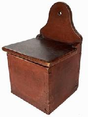 B637 Early 19th century Pennsylvania Salt Box with the original red paint. Dovetailed case featuring an arched back with hole for hanging. The wood is walnut. Circa 1820.  Measurements: 12 1/4" tall x 8" wide x 7 1/2" deep