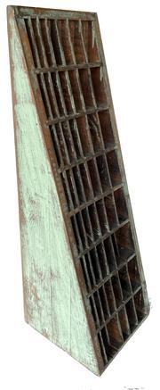 L66 Unusual early 20th century original blue painted Country Store display cabinet with remnants of original label on the back. Tapered, triangular shape wooden case with individual dividers and mortised stretchers. Remnants of an old wooden ruler remains intact on the lower right side. Found in Pennsylvania. Measurements: 9 ½ wide x 30 ¾ tall. Top is ¾ deep and tapers to 10 ¼ deep at bottom.
