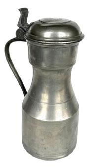 L267A 18th century Pewter Lidded Flagon engraved with various initials and “H” “1753” on top of lid and prominently “DC” with faint remnants of “1753” on bottom. Heavy with sturdy handle and working hinged lid. Approximate measurements: 5” diameter bottom x 10 ½” tall.