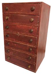 C550 19th century New England Set of seven graduated drawers, in the original red paint, the drawers are dovetailed and well as the case with the original knobs beautiful back
