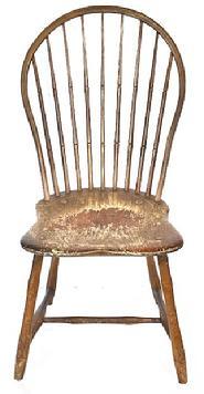 L122 19th century Pennsylvania Bow Back Windsor chair with nine spindle back and bamboo turnings in old mustard paint over original red painted surface. Great wear from years of use. Measurements: 17 wide across front of seat x 16 ¼ deep seat x 36 ½ tall back. The seat is 16 ½ tall.