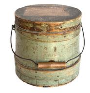 L501 19th century New England original gray painted firkin with tongue and grooved staved sides secured with steamed and bentwood bands. Each band is secured with small tacks and one tiny staple at the end of the fingerlap. Remnants of paper label on lid. Nice wear. Clean, natural patina interior. Measurements: 7 3/8 diameter (top) x 8 ¼ diameter (bottom) x 7 ¼ tall.
