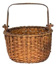 **SOLD** M57 19th century sturdy hand-woven thick oak splint swing handle Basket from Pennsylvania. Nicely woven with a single wrapped, double rim with notched posts that secure the squared, hand-hewn swing handle to the basket with wooden pegs. Slightly rounded bottom is heavily reinforced and boasts a slightly bumped up interior for weight distribution and air flow. Measurements:12 ¼ x 11 ¾ diameter. The sides are 7 ¾ tall. Approximately 14 tall with handle up.