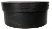 RM1091 19th Century small black painted lapped-seam Covered Box, America, round form with pine top and bottom and bent maple sides joined with opposing lapped fingers. Measurements are: 7" x 5 1/2" x 3"