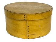 L412 19th century New England Pantry Box with beautiful original dry mustard painted surface and clean, natural patina interior. Steamed and bentwood construction with overlapping sides being secured with small tacks. Clean, sturdy box with tight fitting lid. Measurements: 10 diameter (top) x 9 ¾ diameter (bottom) x 5 tall.