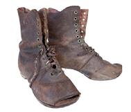**SOLD** K1876 Pair of 19th century brown leather Childrens Shoes / Boots with very worn, patched soles and toes that are worn completely through. Remnants of shoelaces made from period fabric remain intact. Circa 1860s-1880s. Approximately 6 ½ long x 2 3/8 wide x 5 ½ tall.  