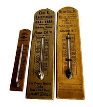 M298 Group of three (3) Wooden Advertising Thermometers: ** Original gold painted surface with black lettering: "Carl E. Lagerstrom Coal Yard Lindsborg, Kansas" **Original mustard painted surface with black lettering: "David Gill, Jr. Mason's Materials Paints Oils Varnishes Kingston, N.Y." **Natural patina surface with black lettering: "Linhart Chevrolet - Jeannette - 209 Made in U.S.A."