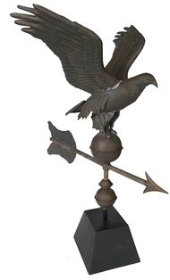 E185 Eagle Weathervanet weathered surface that measures only 24" high including stand and has a petite 14" wingspan. Constructed of copper, this handsome piece of early 20th century patriotic americana is in excellent condition and an outstanding verdigris patina. Because of its desirable small size, this folksy vane makes an easy fit just about anywhere in the house.