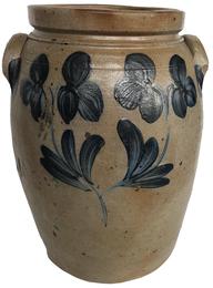E385 Peter Hermann Baltimore, MD – Circa 1855 – 1870 large crock jug with applied handles. A very impressive stamped three gallon Stoneware Crock, decorated with a characteristic stemmed clover motif design that is associated with wares made in Baltimore, MD. A sweeping pattern of brushed flowers enhances this rare oversize vessel – a Classic Peter Hermann, one of Maryland’s premier 19th century potters. Measurements: 14" tall 7 1/2" top diameter