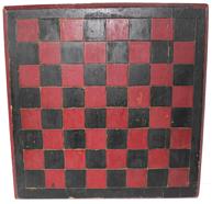 B340 Late 19th century Game Board , with the original red and black paint, one board white pine construction, with a champfered edge, each block on the Game Board is deep scribed, to make each block stand out. carved on the back are the initials (C.C. H.) Measurements are: 14" x14"