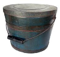 L397 Spectacular identified original blue painted lidded wooden bucket Stamped on bottom
.Made & Warranted, by JAMES WITCHER
. with arched wire bail handle and turned wooden grip. The thick, solid wood lid is rimmed by a ¾ tall metal band secured with hand forged tacks. The interior is old natural patina. Tongue and grooved staved construction held in place with ¾ tall metal bands secured with hand forged tacks. Measurements: 11 ¾ 12 top diameter x 10 ¼ bottom diameter x 9 ¼ tall.