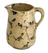 CM7 Small Spongeware Salt Glazed Pitcher featuring teal and tan colored sponge decoration on an ivory- colored background. No chips or cracks. Crackling to surface indicative of age. Measurements 4 ½ tall and rests on a 2 ½ diameter footed base.