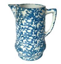 L331 19th century blue and white Spongeware pitcher boasting the classic sponge-applied blue speckled pattern on durable white stoneware. A banded embossed/impression of double diamond patterns encircles the bulbous base. Handle and spout are in good condition. Measurements: The footed base measures 4 ¾ diameter. Overall height is ~9 tall.
