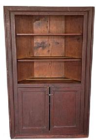 RM1045 Early 19th century New York State, open top Corner Cupboard in the original dry dark red surface, with two plank doors. three wide board back, plate rails on each shelf, the wood is white pine square head nail construction. Circa 1820 Measurements are: fits a 34 1/2" corner and