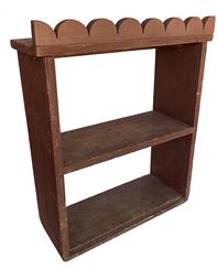 X371 Late 19th Century North Carolina hanging wall shelf with mortised center shelf and an unusual applied scalloped top in original dry red paint. Measurements: 20 ¼” wide x 7 ¾” deep x 24 ½” tall