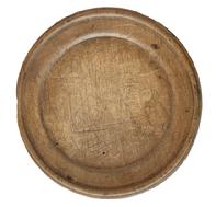 L511 Early wooden treenware plate with nice turned, raised lipped edge retaining a great, worn surface with natural patina. Measurements: 7 x 6 ¾ diameter x ½ to 5/8 tall, depending on where measured.