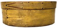 F49 Mid-19th century Oval pantry box in the original mustard paint with finger lapped top. Bentwood construction with tacked lap joints. Measurements are: 6 1/2" x 3" tall